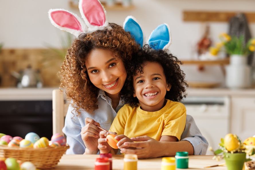 Mom and child painting easter eggs