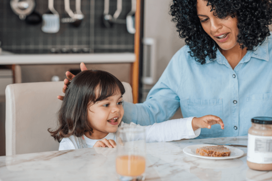 girl enjoying non perishable snack with mom 