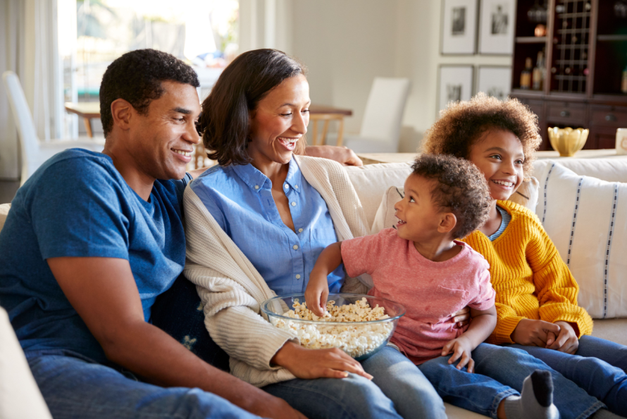 entire family snacking in couch